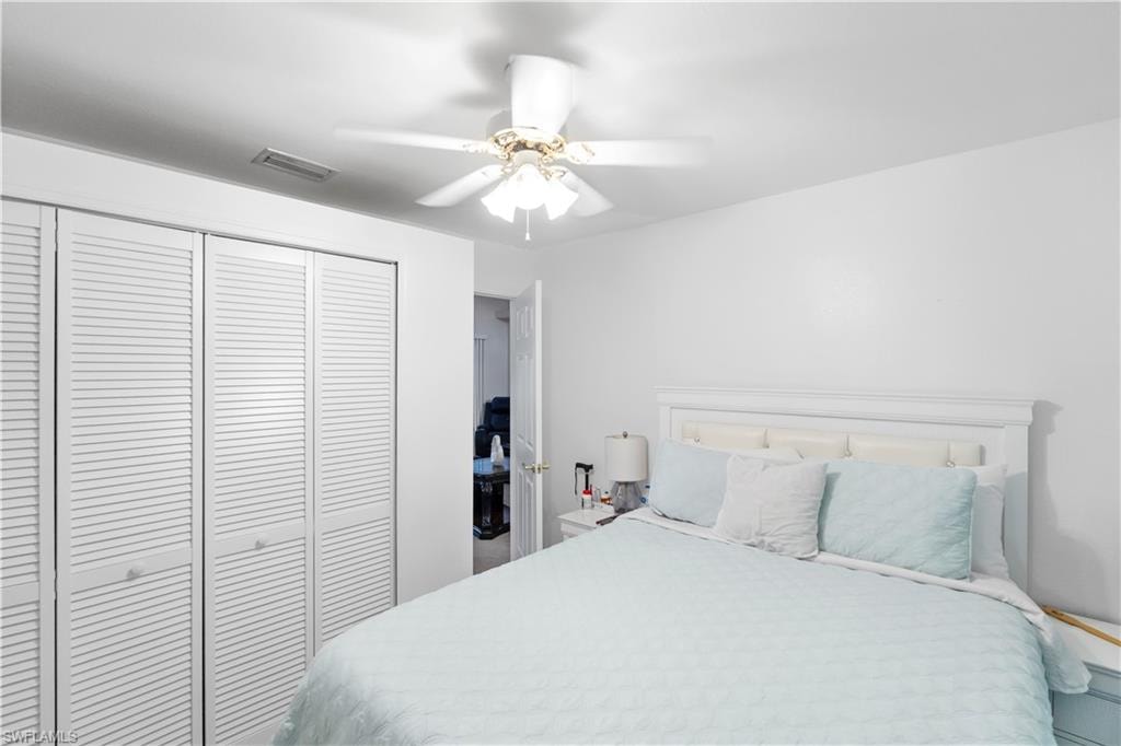 Bedroom featuring a closet and a ceiling fan