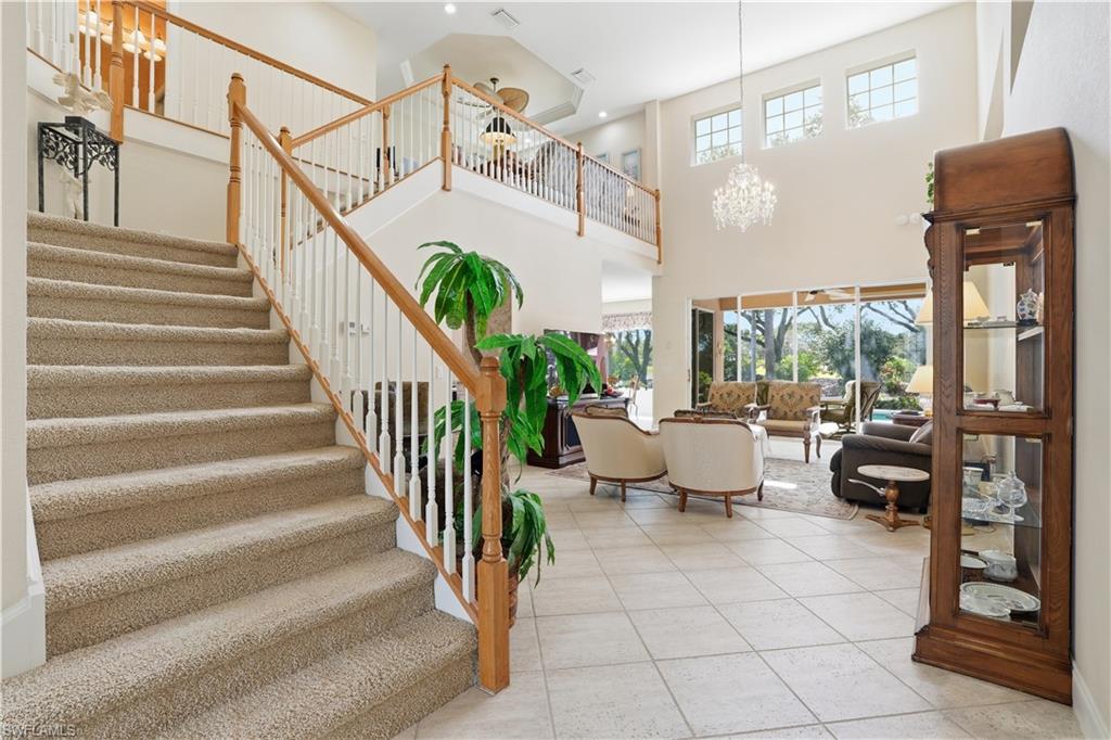 Stairs lead to loft overlooking living area.