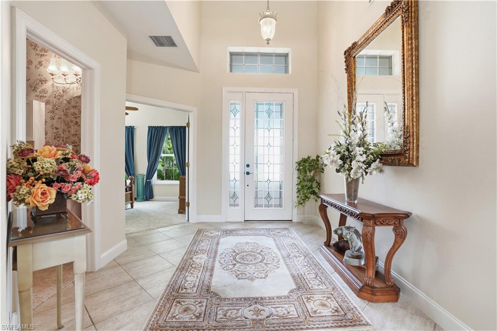 The grand entryway provides a warm and inviting welcome.