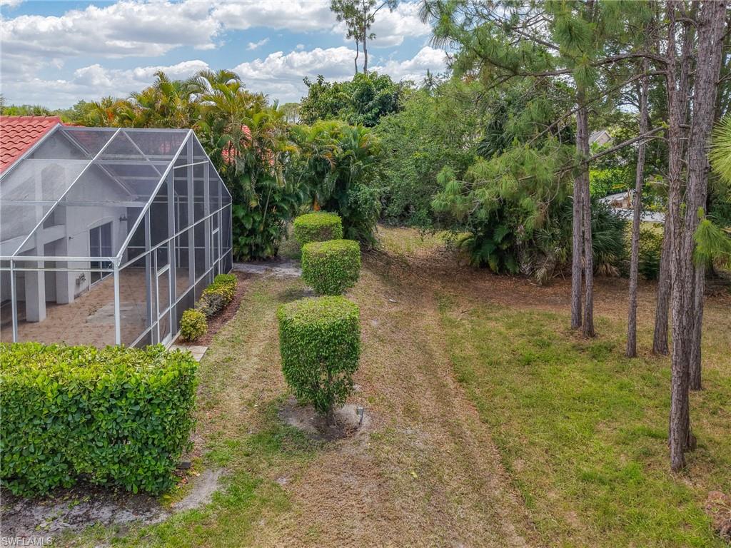 View of yard featuring a lanai
