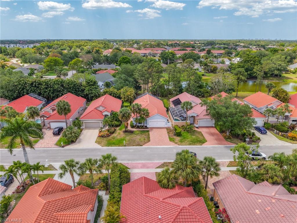 Birds eye view of property with a residential view and a water view