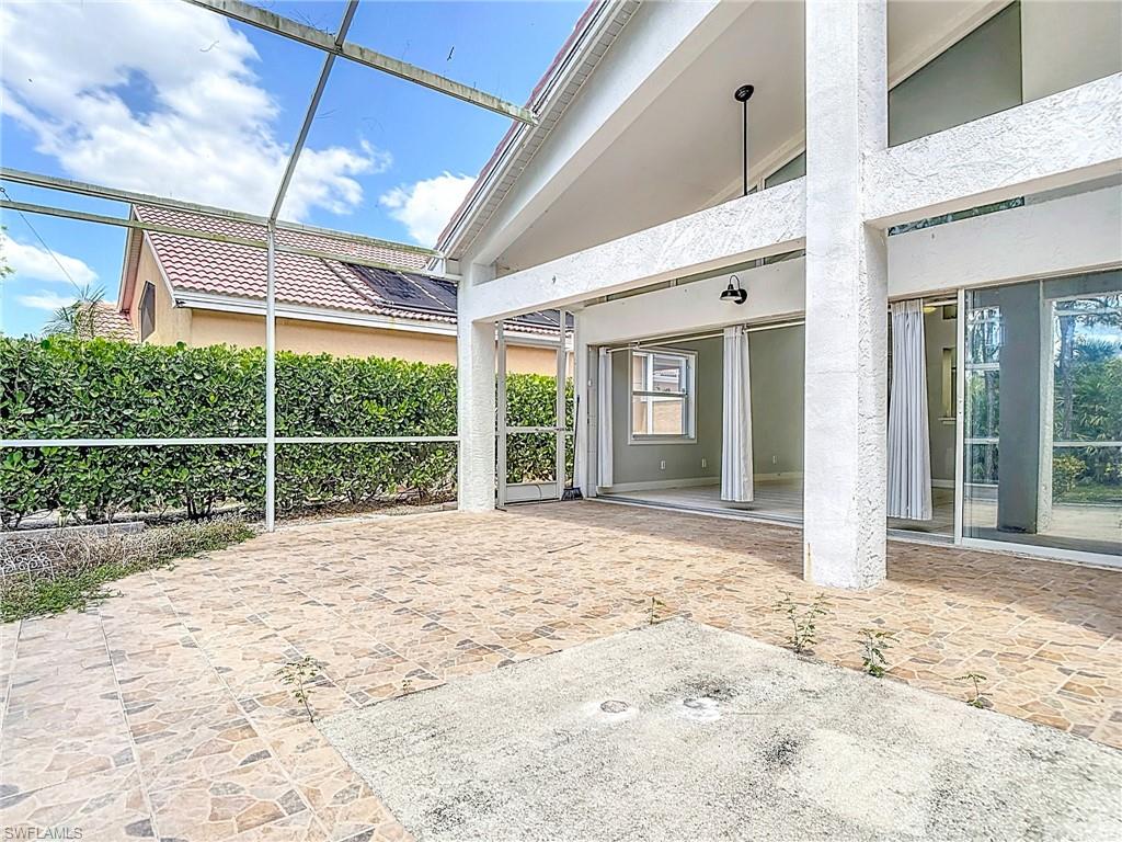 View of patio / terrace featuring glass enclosure