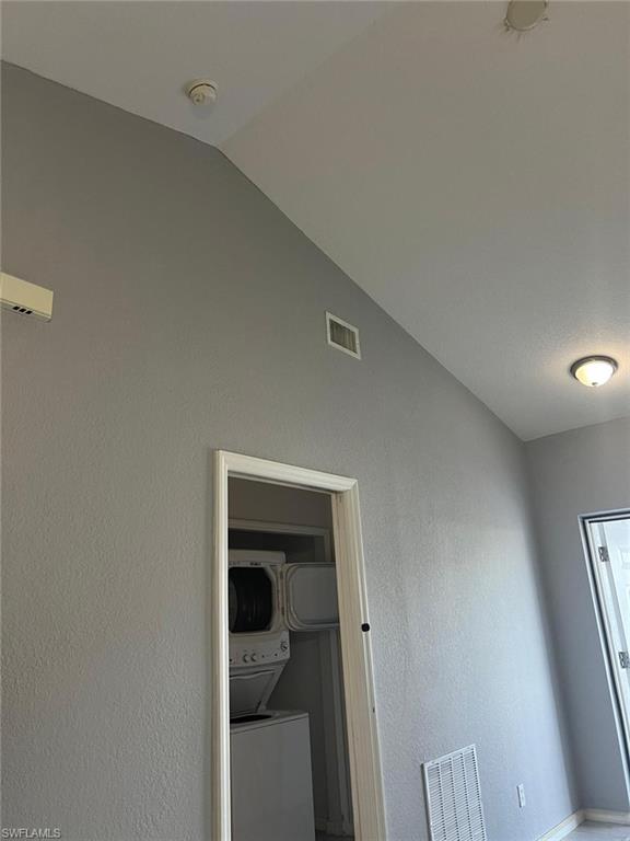 Covered outdoor seating area featuring ceiling fans and recessed lighting