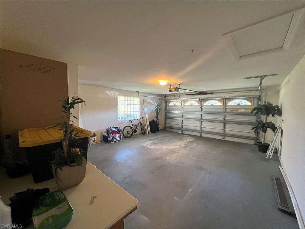Garage featuring a garage door opener