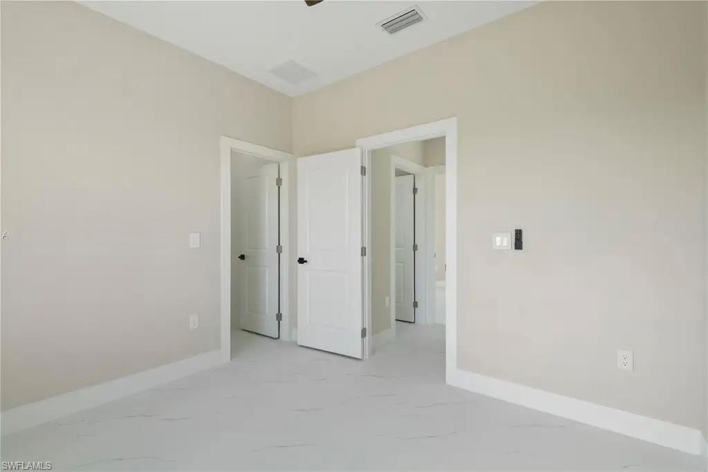 Spare room with light marble finish flooring