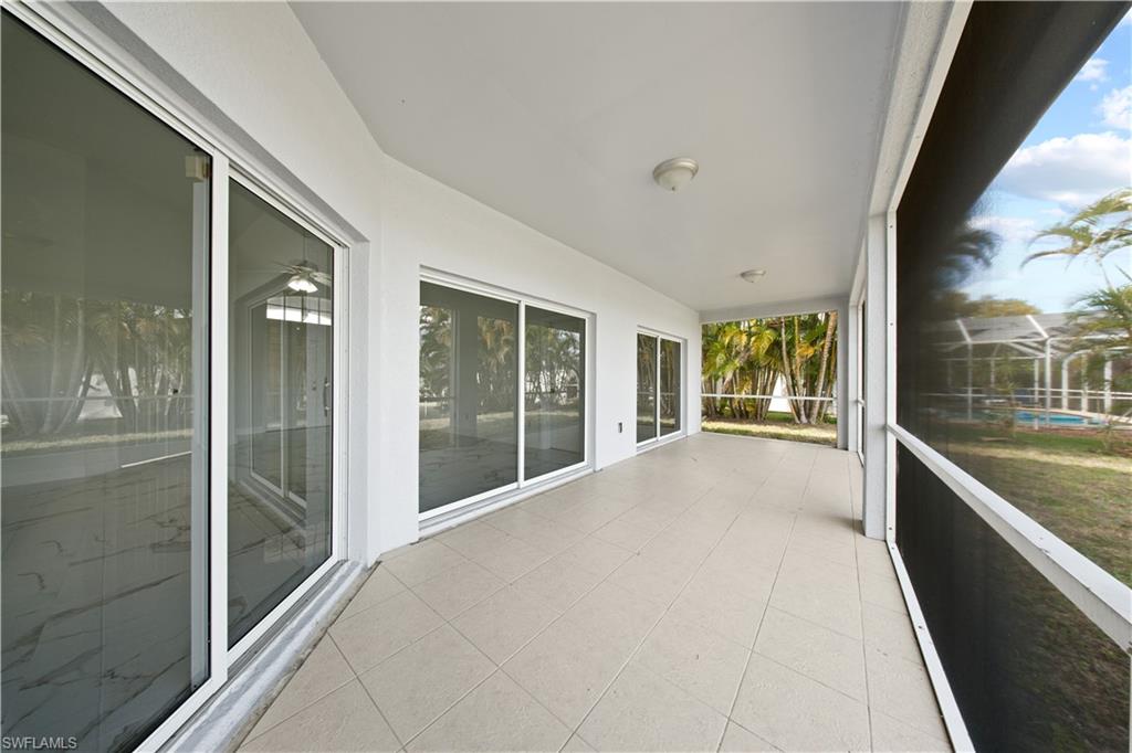 Unfurnished sunroom featuring tile patterned floors