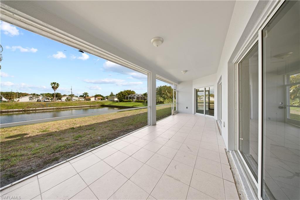 View of patio featuring a residential view and a water view