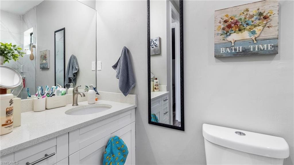 Bathroom featuring vanity and toilet