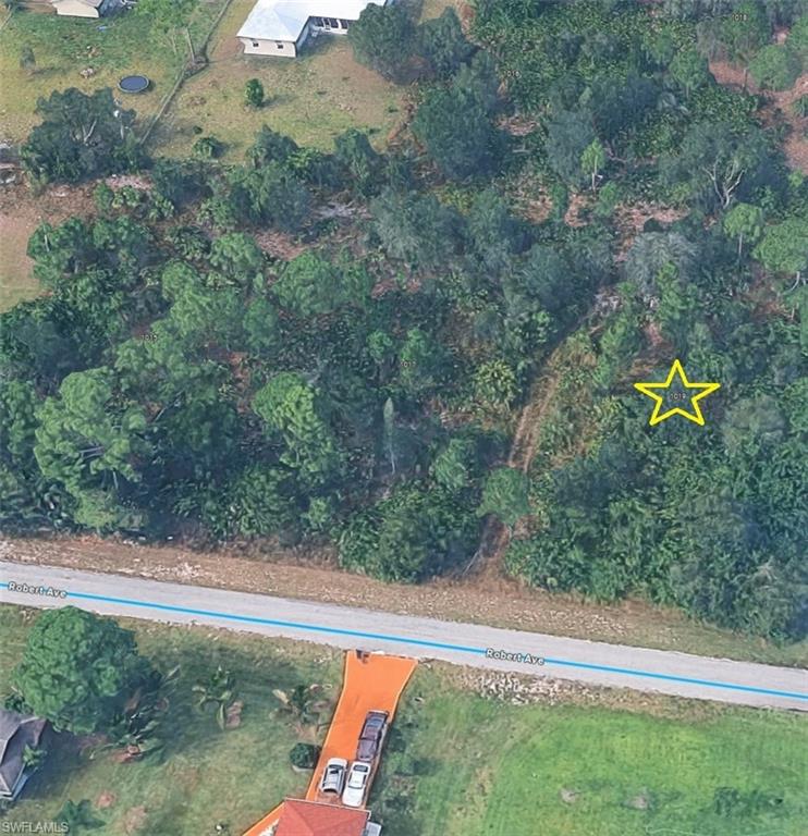 Three empty lots in a row, 1019 Robert Ave farthest right.
