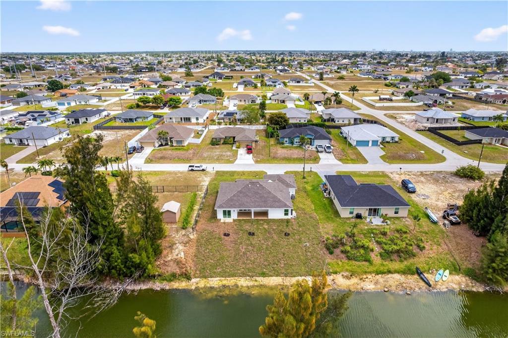 Set on a WEST-REAR EXPOSURE freshwater canal, this property delivers breathtaking sunset views and a peaceful waterfront setting perfect for kayaking, relaxing, or simply embracing Florida’s outdoor lifestyle.