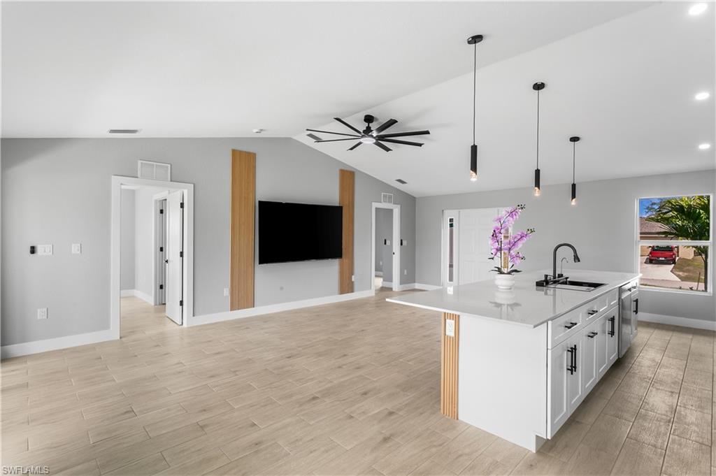 The elegant front entry with dual glass sidelights welcomes you into a sophisticated yet inviting interior.