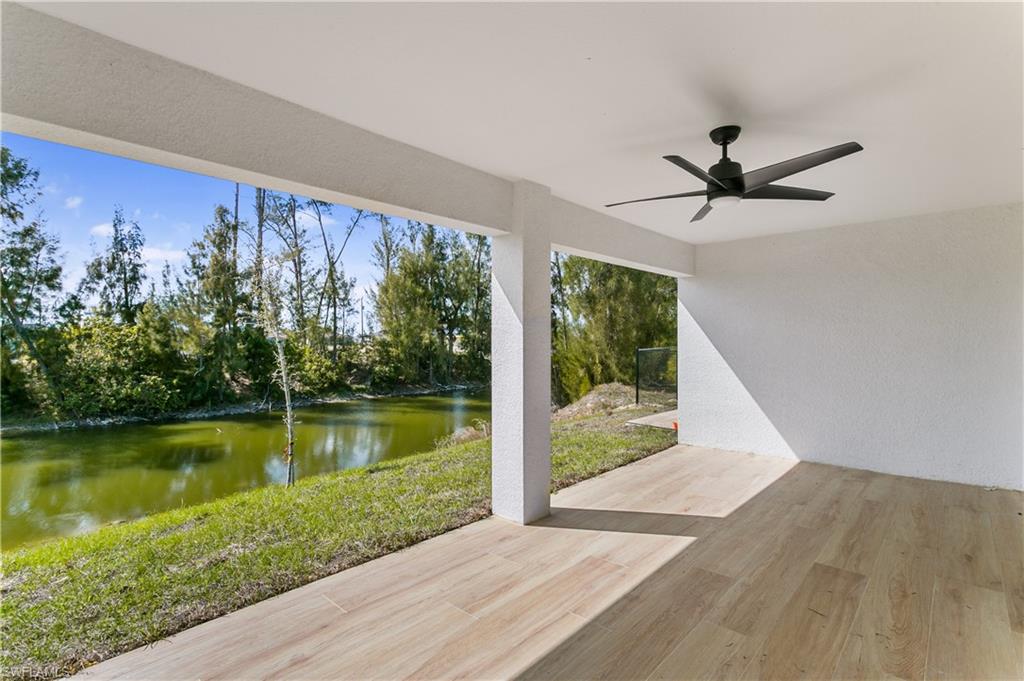 The covered lanai with ceiling fan creates the ideal space for year-round entertaining, morning coffee, or evening unwinding, while the expansive backyard offers room to build your dream pool or outdoor oasis.
