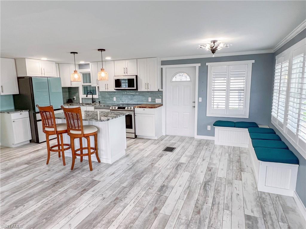 Open concept living, dining and kitchen