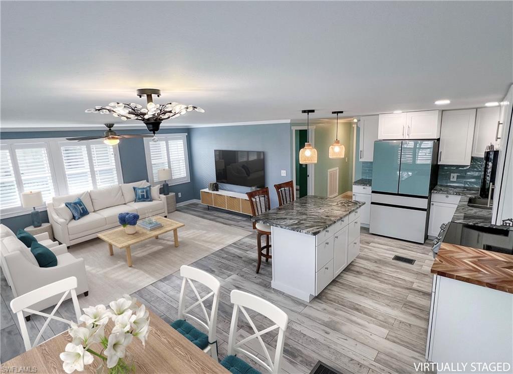 Virtual staged dining, living and kitchen areas