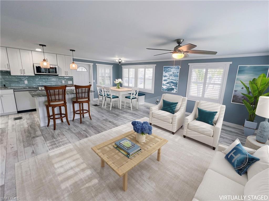 Virtual staged dining, living and kitchen areas