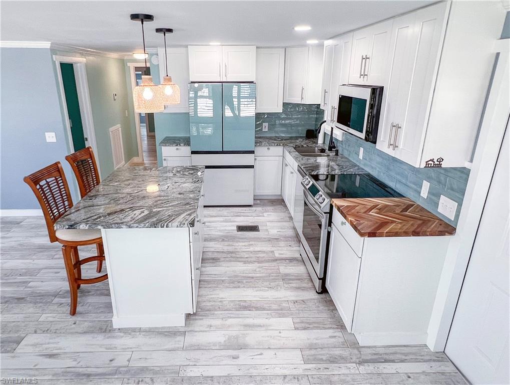 Open concept living, dining and kitchen