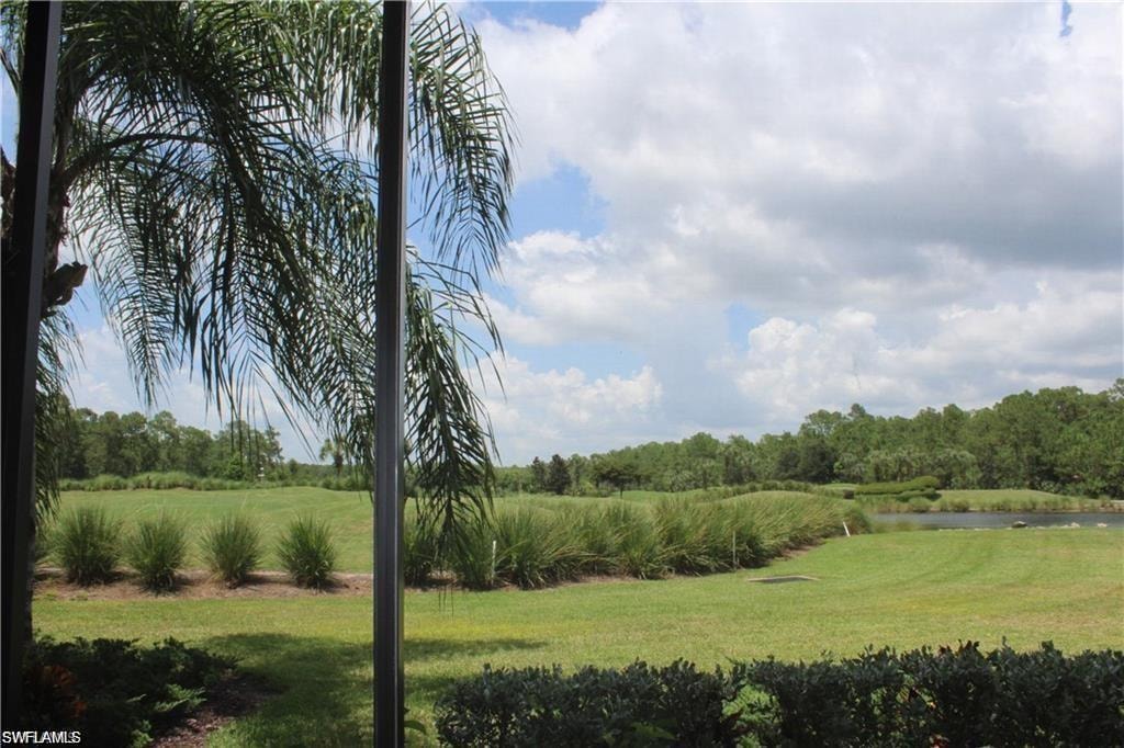 View of yard with a water view