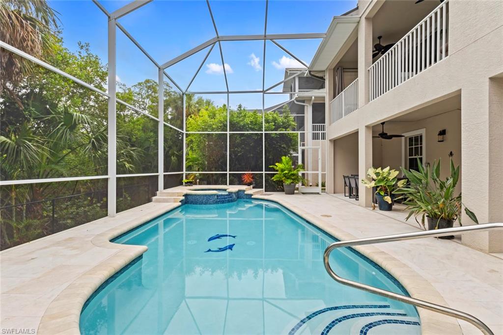 Large screened pool deck (with both a heated pool & spa) with mangroves behind you.