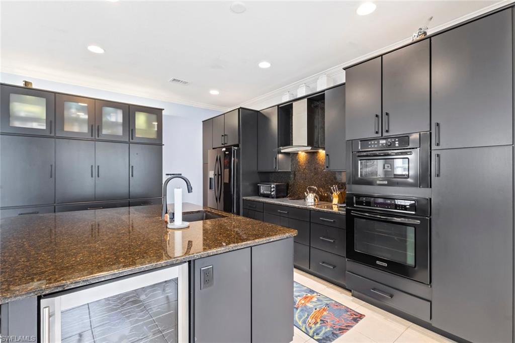 Island also features a built in beverage cooler/wine fridge