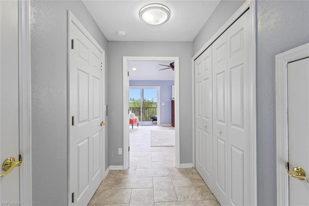 Entrance to the primary suite. Elevator to the left. Laundry to the right