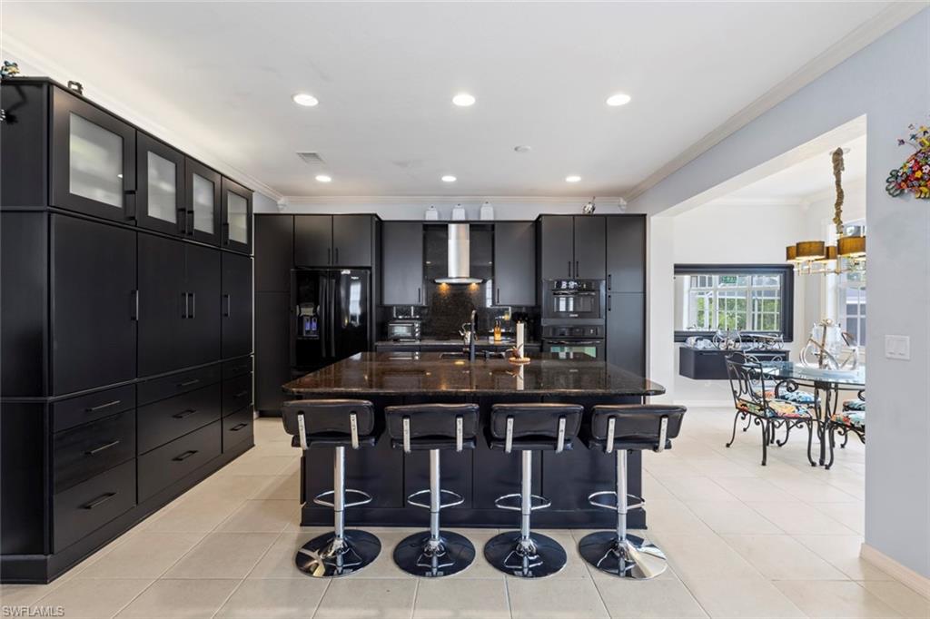 Sleek kitchen with lots of storage and a large island.