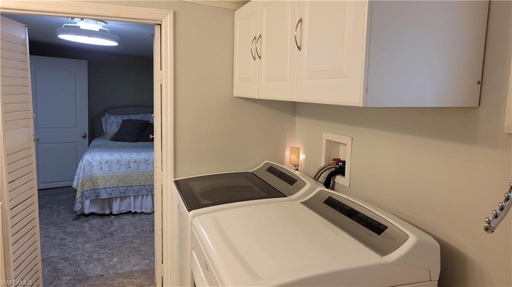 View from ensuite with washer and dryer looking into Master Bedroom