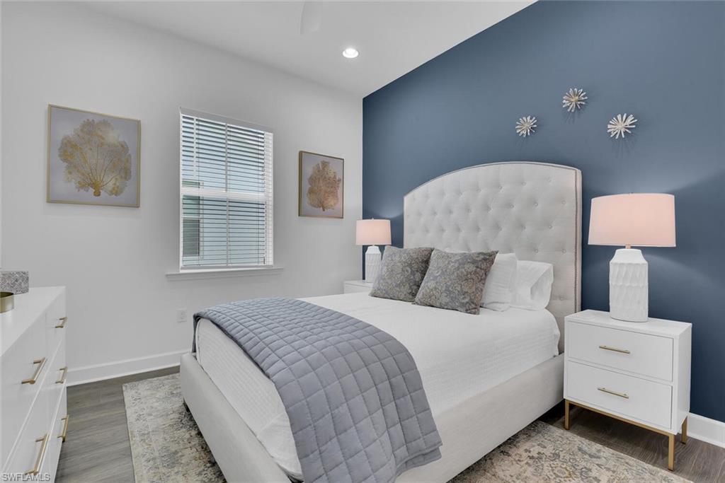 Bedroom featuring baseboards, recessed lighting, and wood finished floors