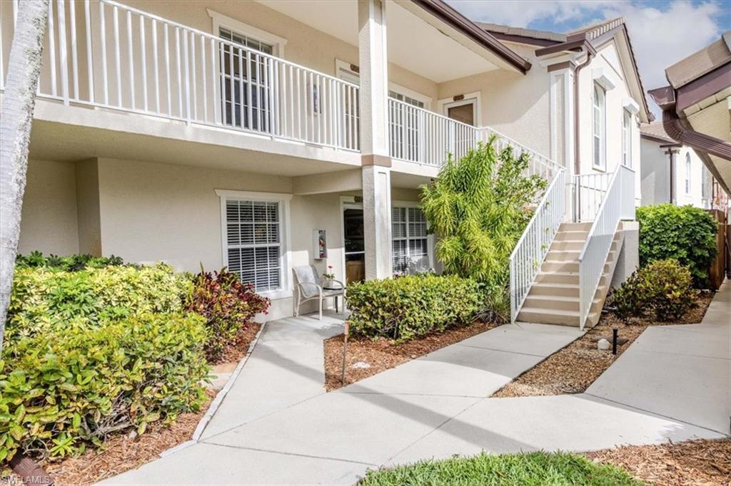 Property entrance featuring stucco siding