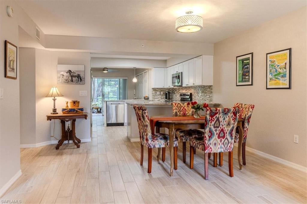 Dining space with light wood finished floors and baseboards