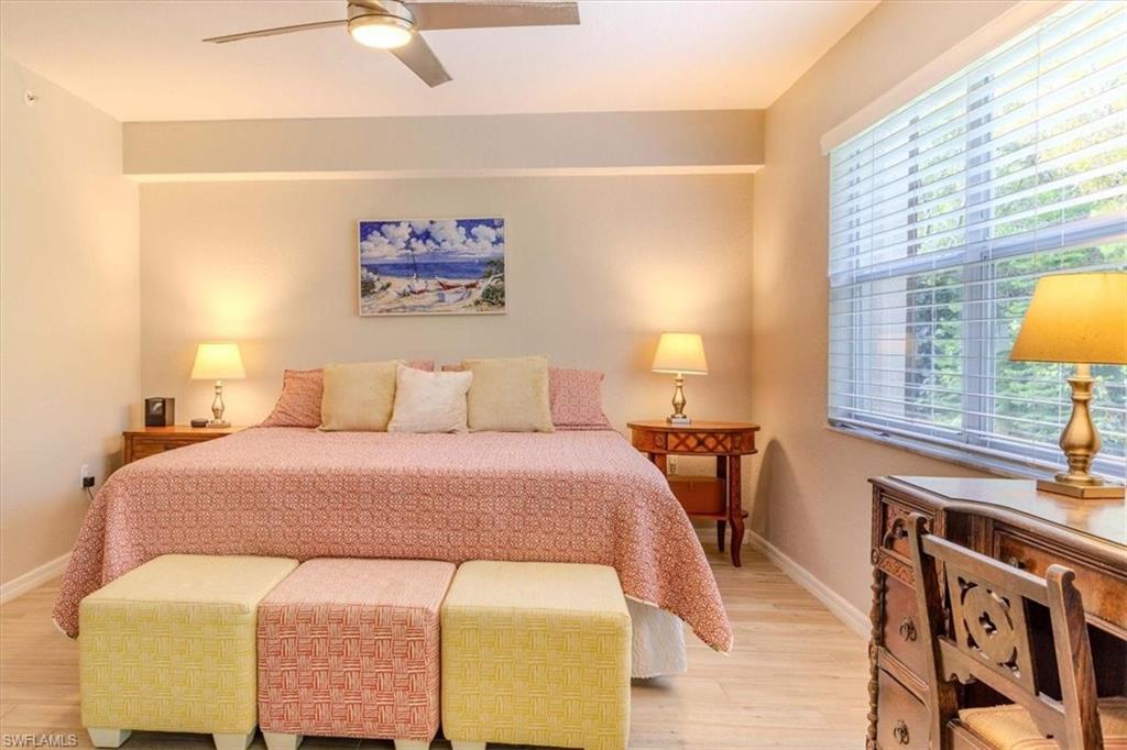 Bedroom featuring light wood-type flooring and ceiling fan