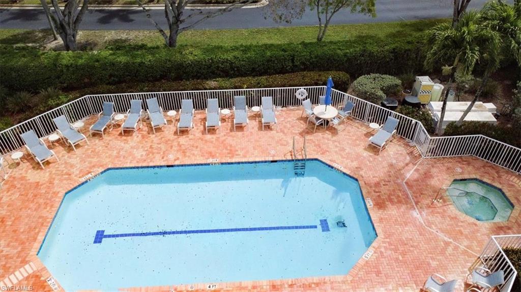 Community pool featuring a patio