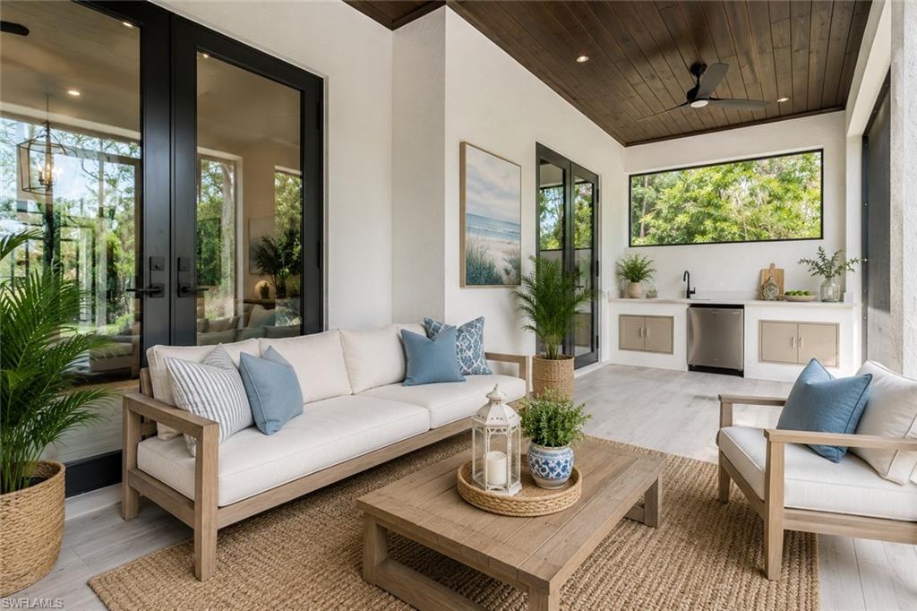 Lanai with outdoor kitchen (Staged Furnishings)