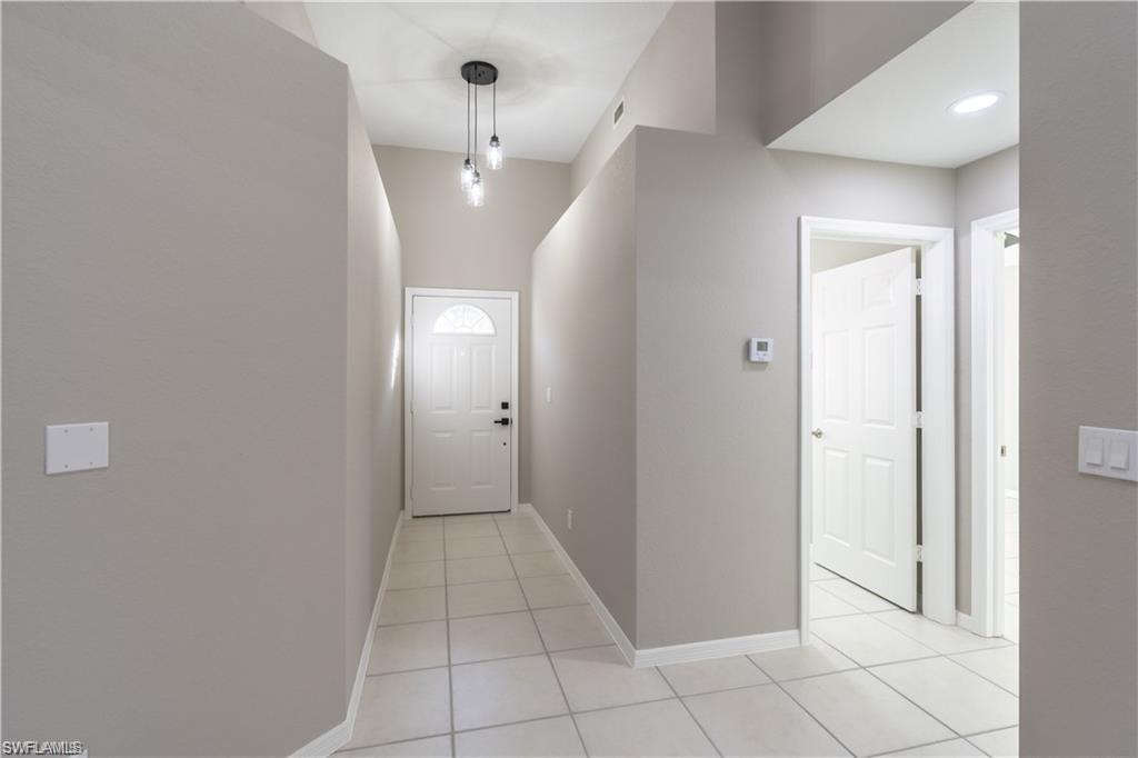 Entry Hallway, freshly painted walls and access to the Guest Bathroom and Guest Bedroom