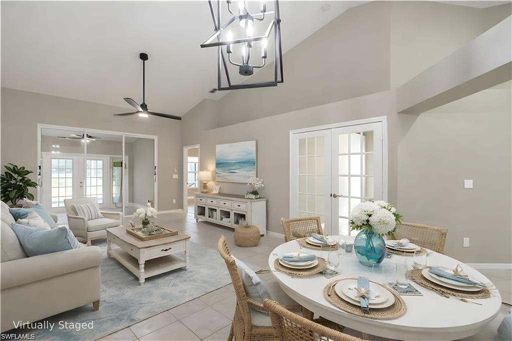 Virtually Staged Great Room with access to a Bedroom (French Doors), the Master Bedroom, a Sunroom and the Lanai