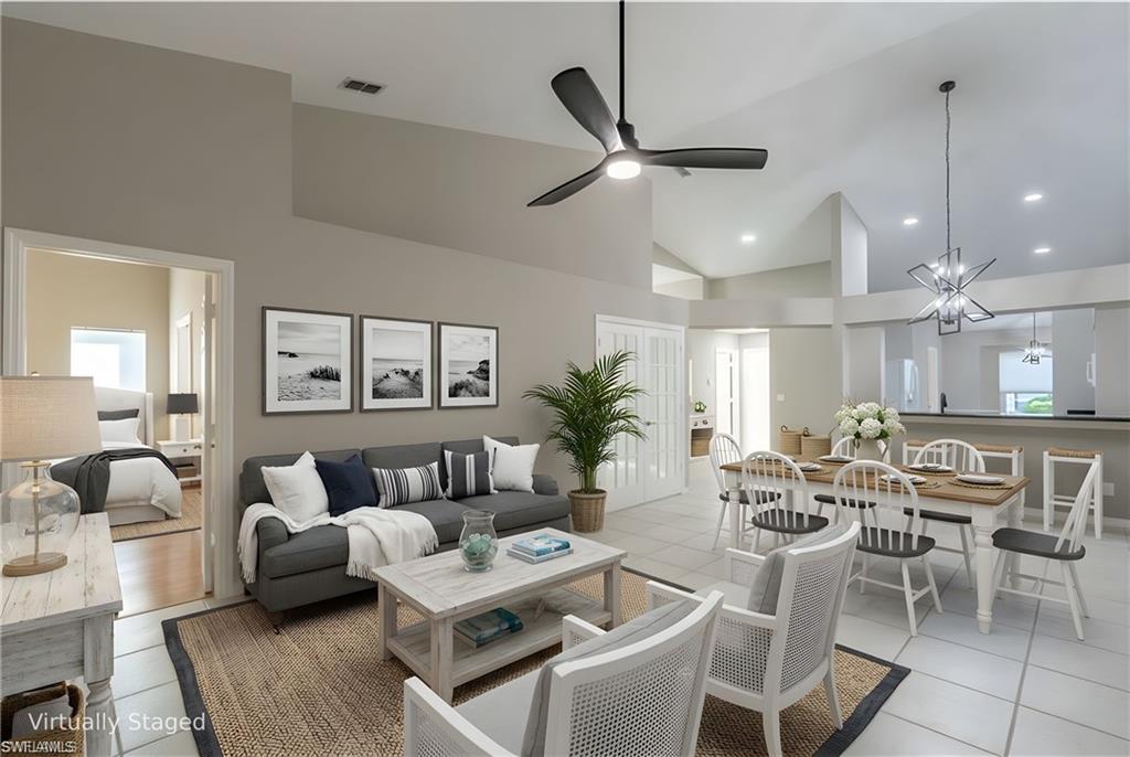 Virtually Staged Great Room with Living and Dining Area and Kitchen in the back
