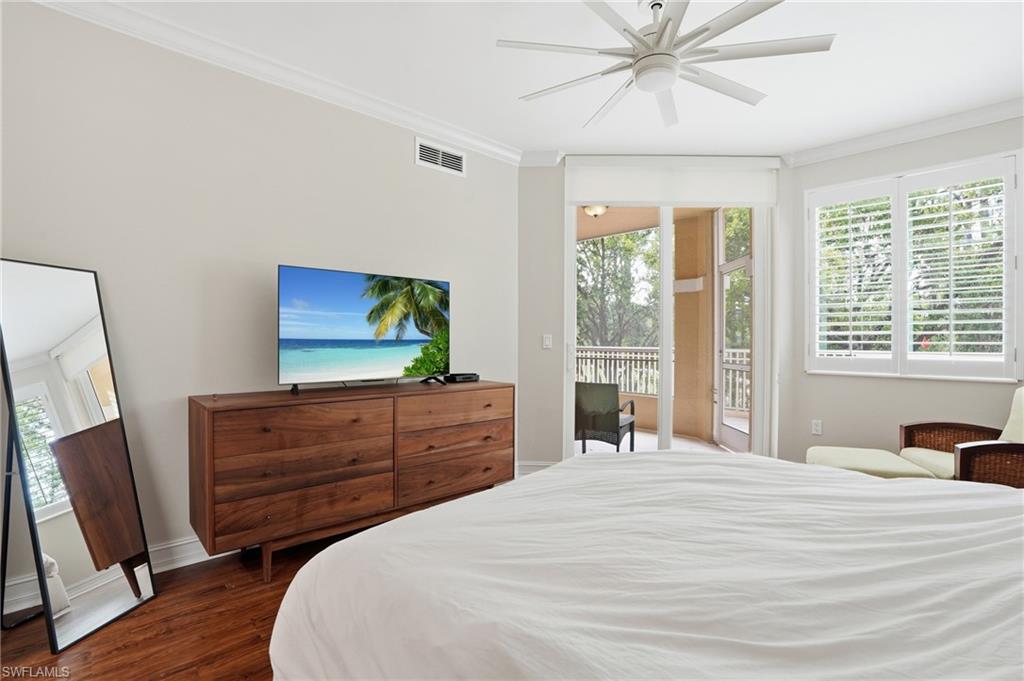 This room features hardwood floors and crown molding