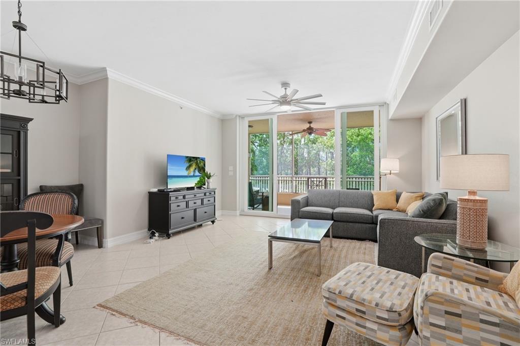 Well-appointed kitchen featuring white cabinetry, integrated oven, a stainless steel sink, and a tiled backsplash
