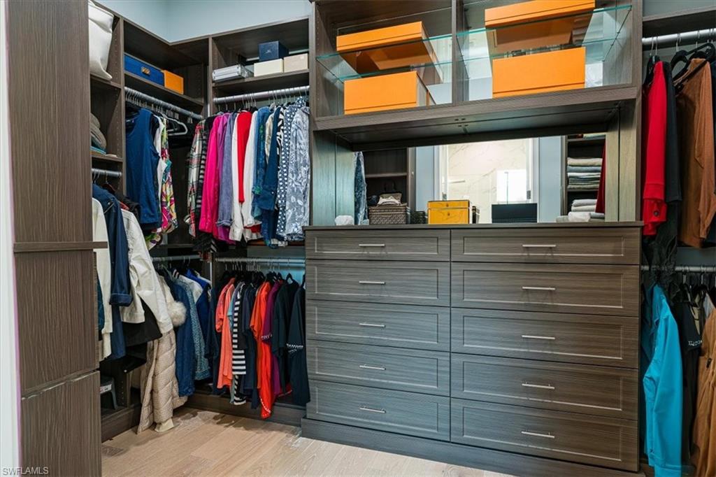 Master Suite Walk-in Closet with Custom Shelving