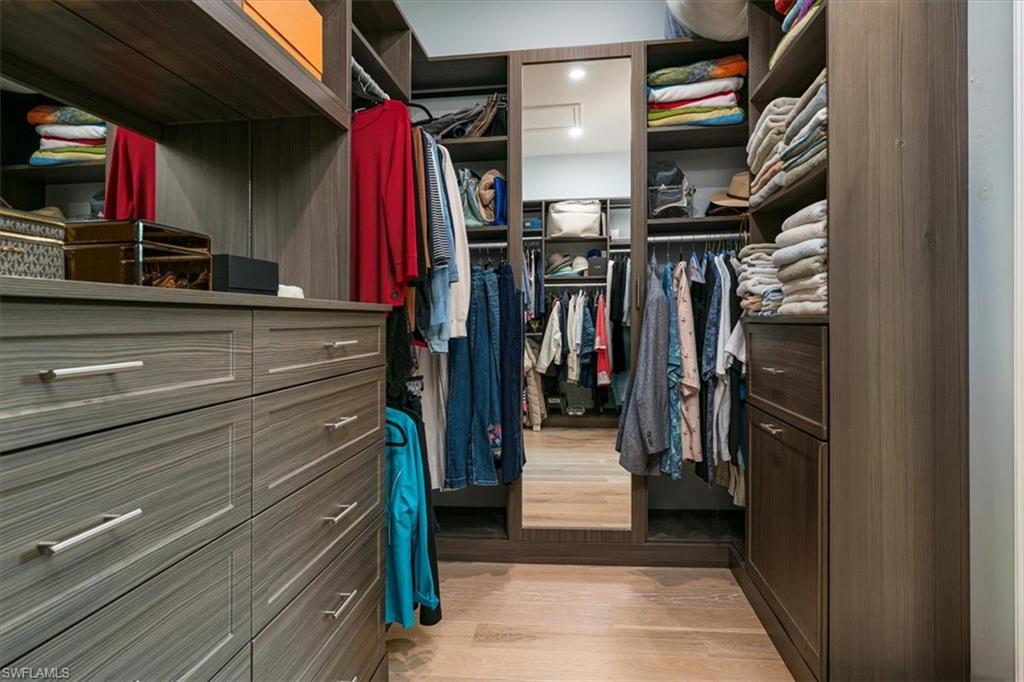 Master Suite Large Walk-in Closet with Custom Shelving