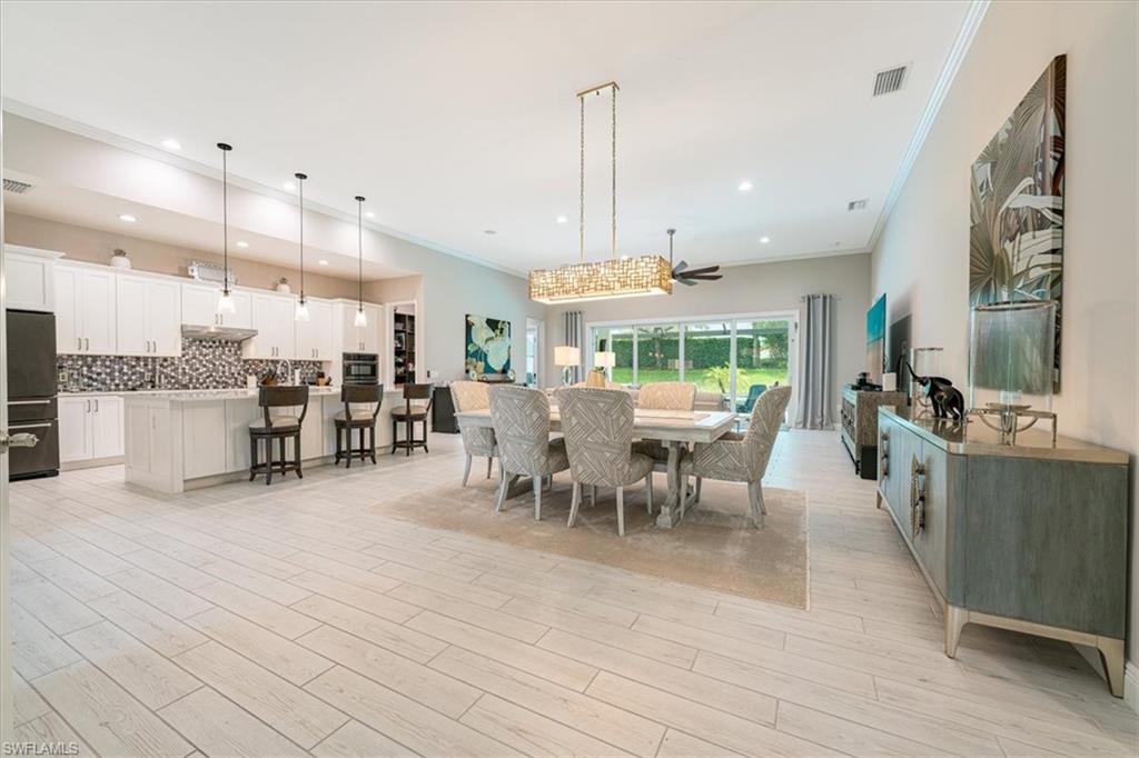 Formal Dining Area with Custom Lighting Fixture