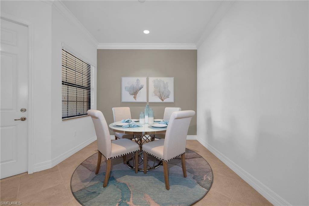 Light-filled dining area with neutral finishes and an open, airy feel.