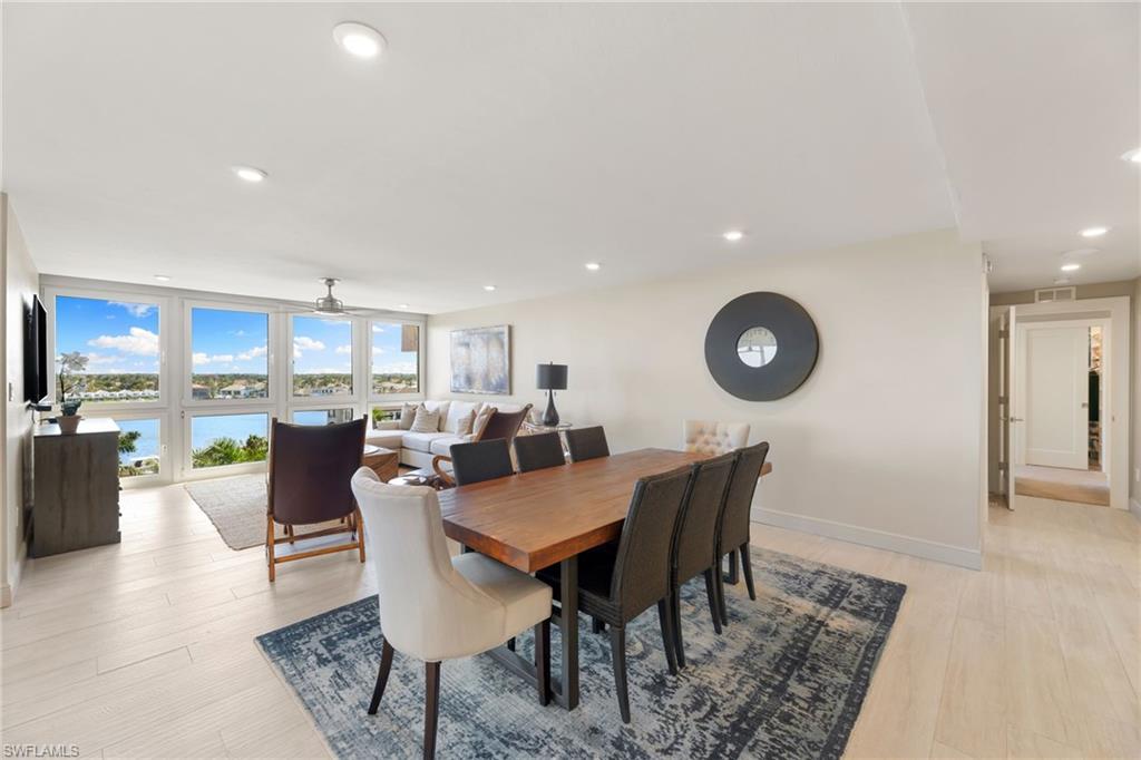 Dining room featuring light wood finished floors, ceiling fan, recessed lighting, and baseboards