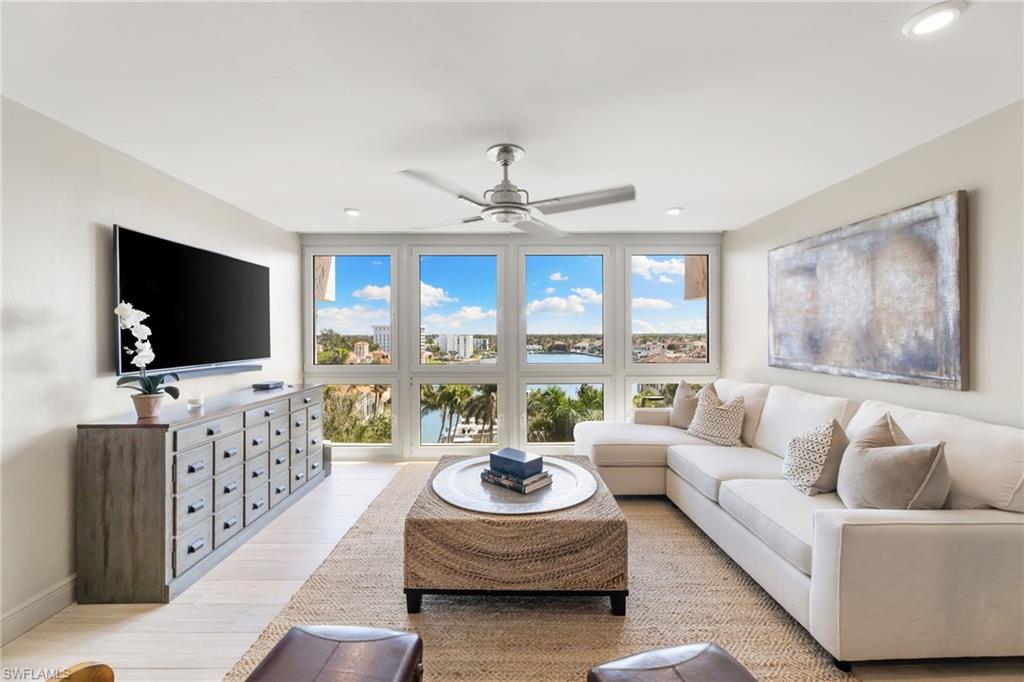 Living area featuring ceiling fan, light wood-type flooring, and recessed lighting