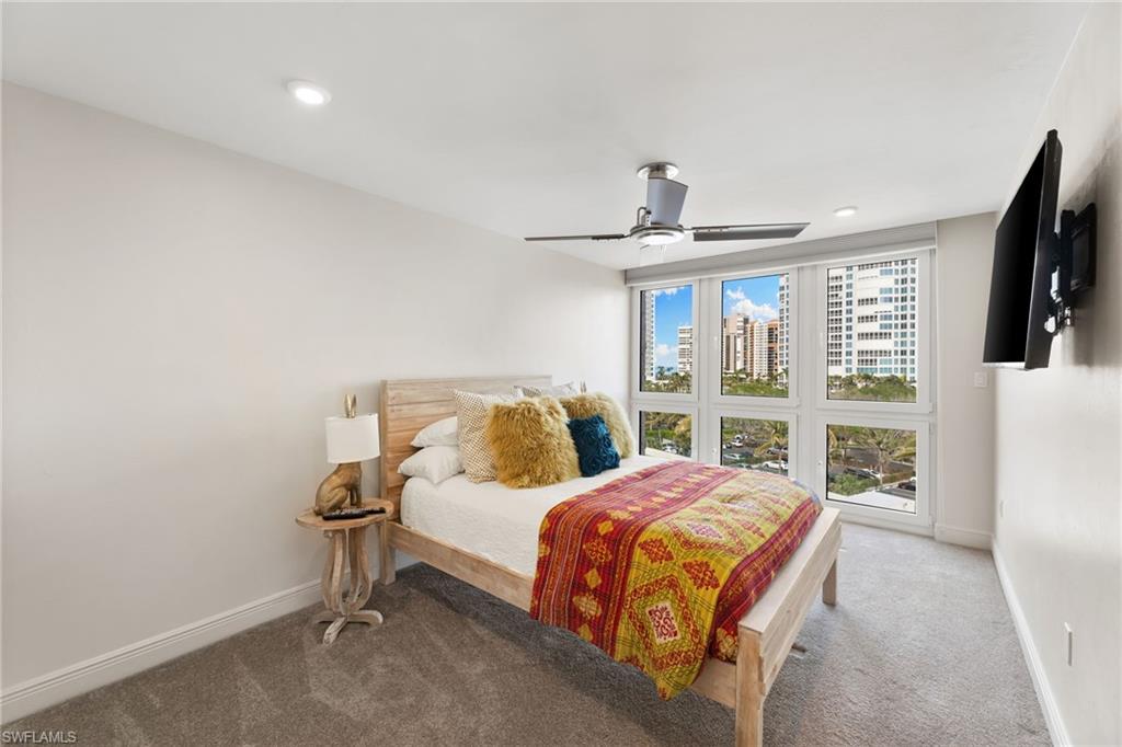 Bedroom featuring carpet, baseboards, ceiling fan, and recessed lighting