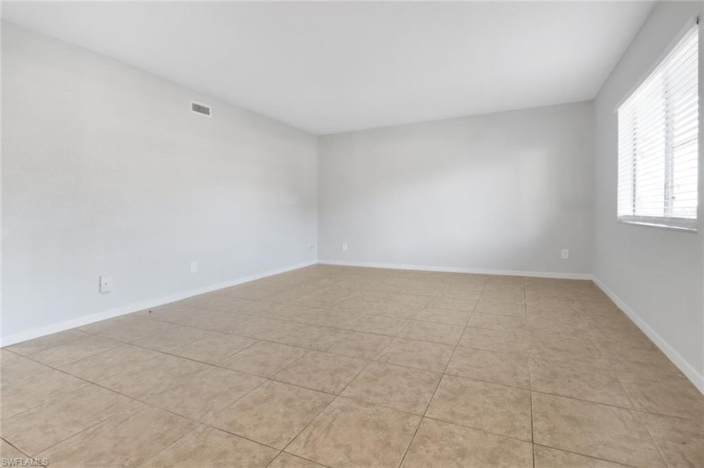Spare room with visible vents and baseboards