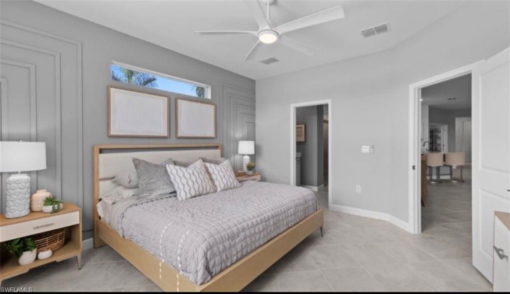Bedroom with ceiling fan and ensuite bathroom