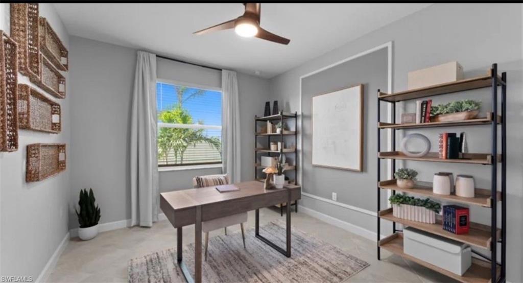 Office featuring baseboards and ceiling fan