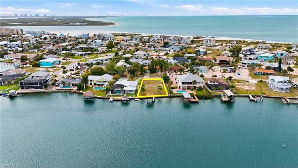 Aerial perspective of suburban area with a large body of water - Virtually Edited Image