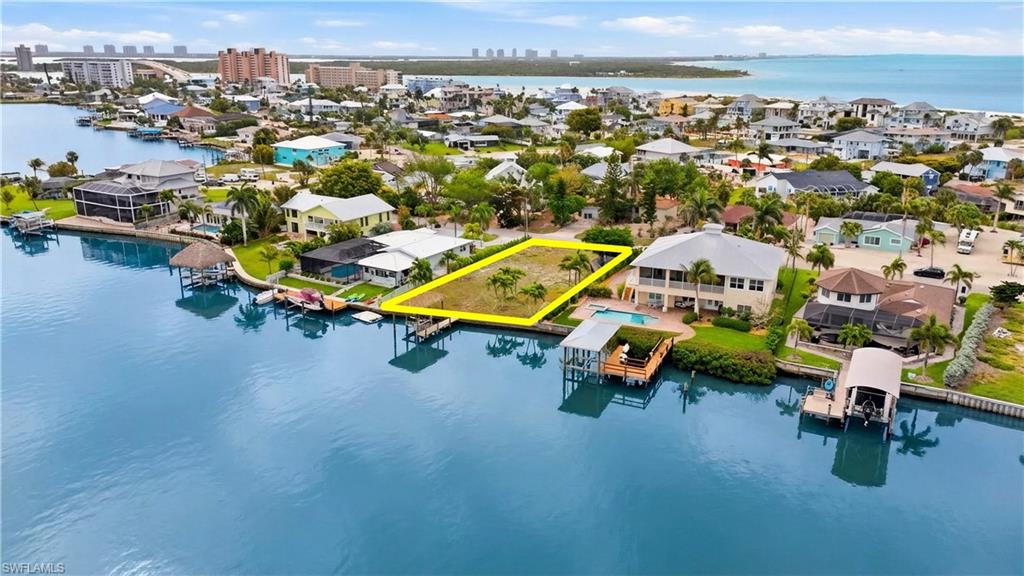 View of urban area featuring a large body of water - Virtually Edited Image