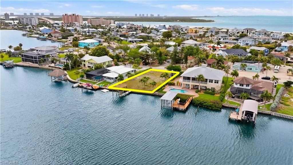 View of urban area featuring a nearby body of water - Virtually Edited Image